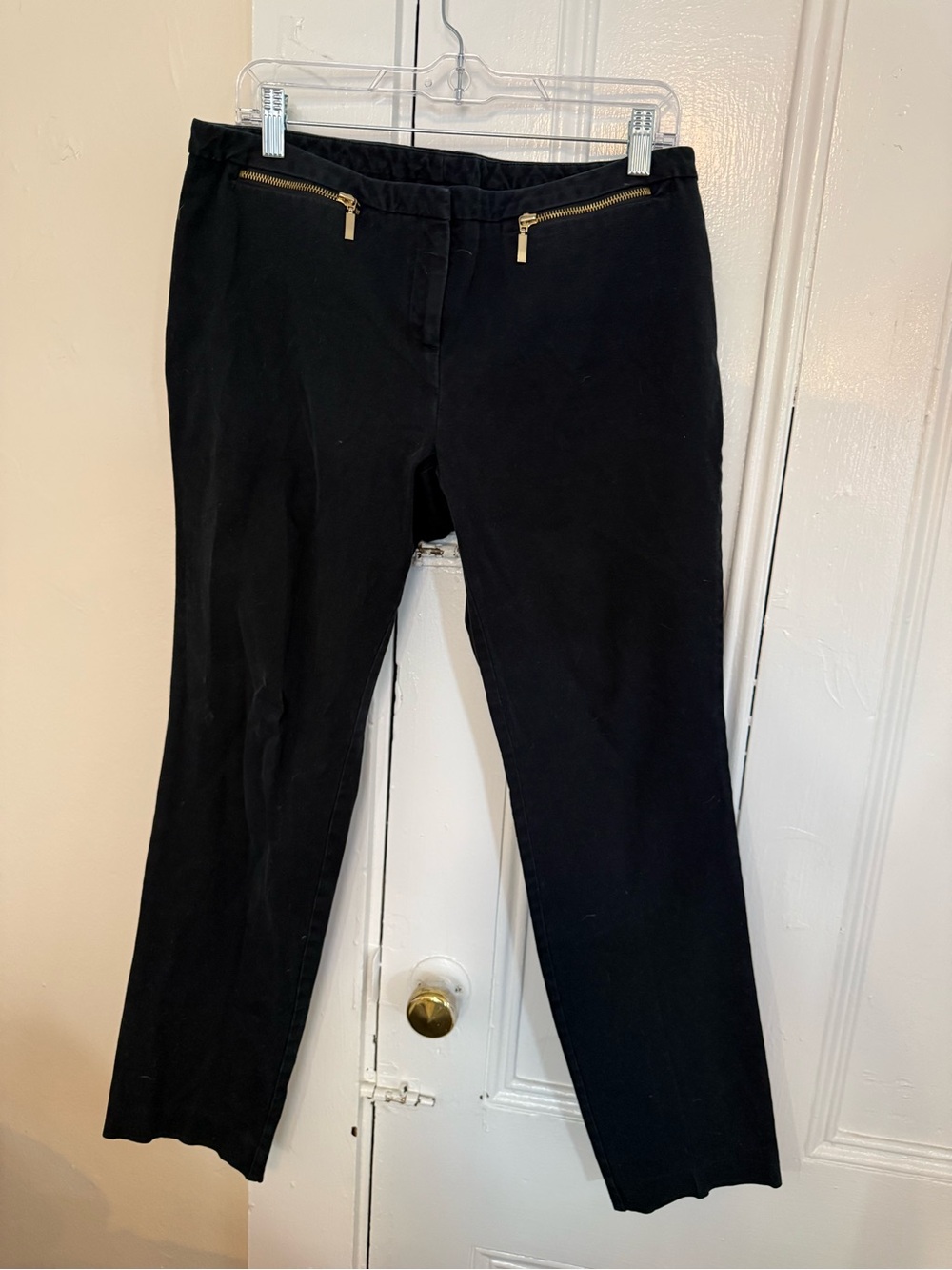 Women’s black dress pants with gold zippers